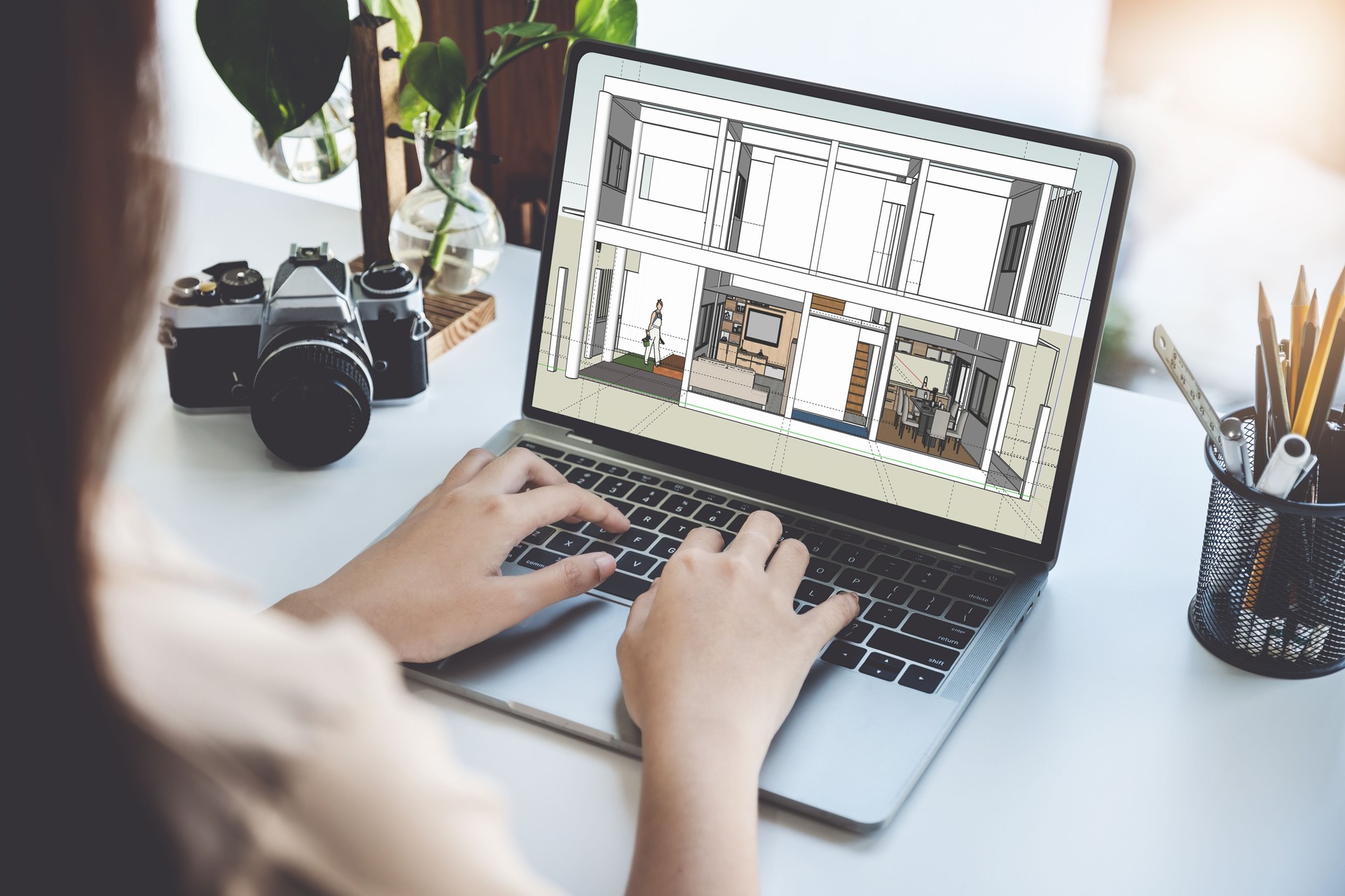 Architects or designers engineers, interior designers, female designers are using home interior design computer programs to send clients to their clients.